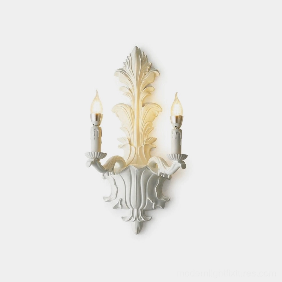 Barocelle carved acanthus-leaf wall sconce in matte white with dual flame-tip candle arms, front view on white background