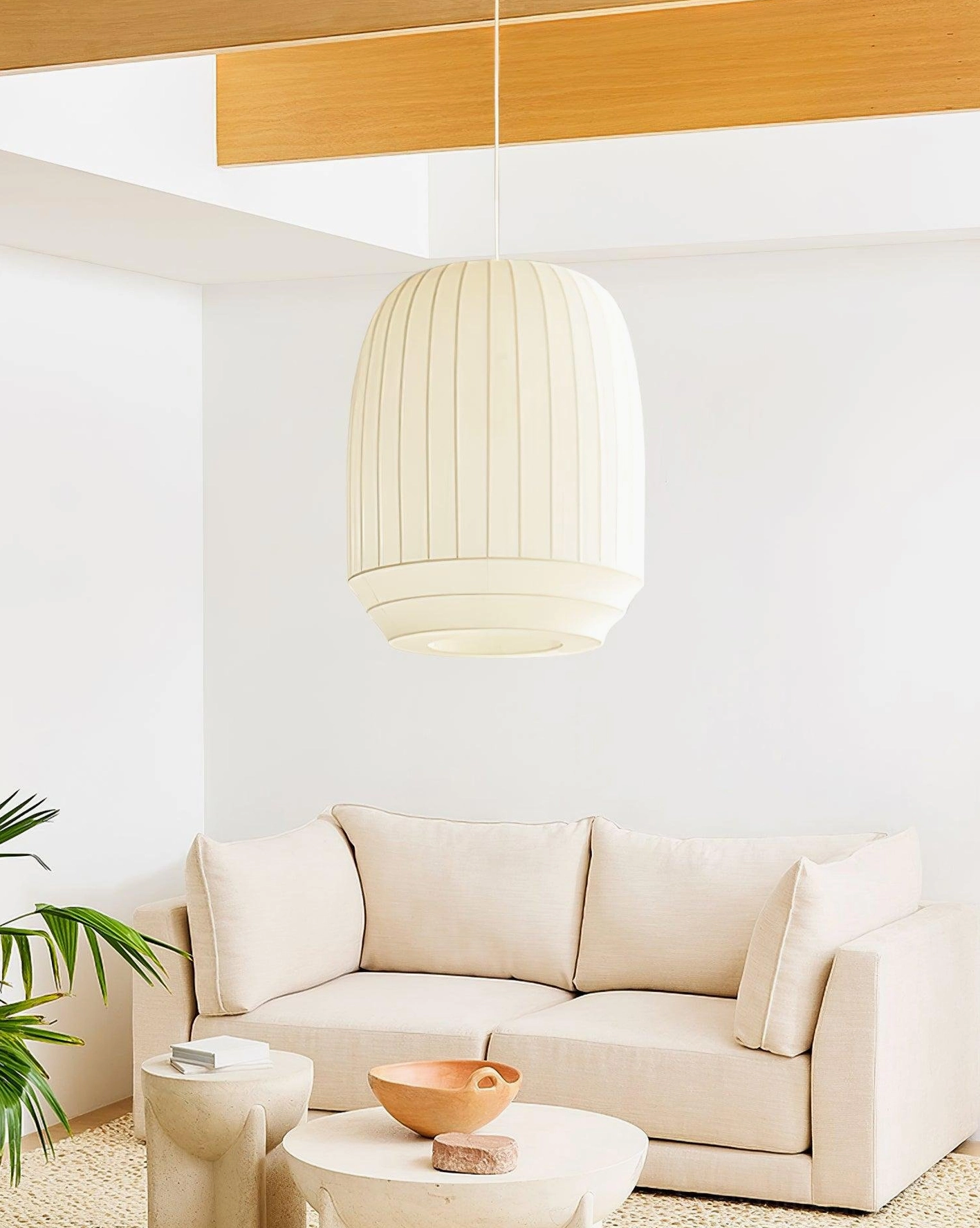 Barrel-shaped fabric pendant light - cream white modern hanging lamp eye-level view