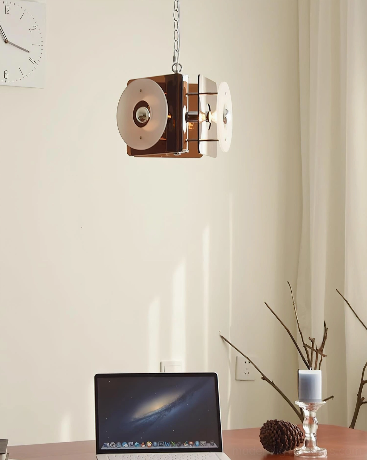 Basira geometric pendant lamp in home office workspace with laptop and desk accessories