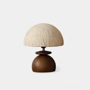Basira mushroom table lamp with textured cream paper shade and dark walnut wood stacked base, front view on white background