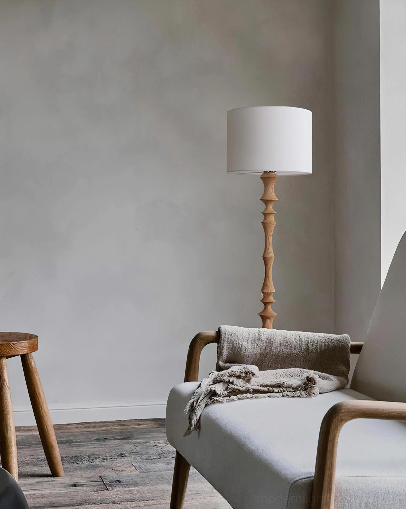 Light natural wood Bastino floor lamp with off-white fabric shade contemporary living room