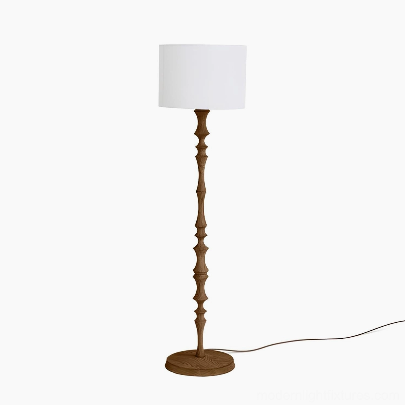 Walnut finish Bastino floor lamp with hand-turned wood stem and frosted globe in styled interior