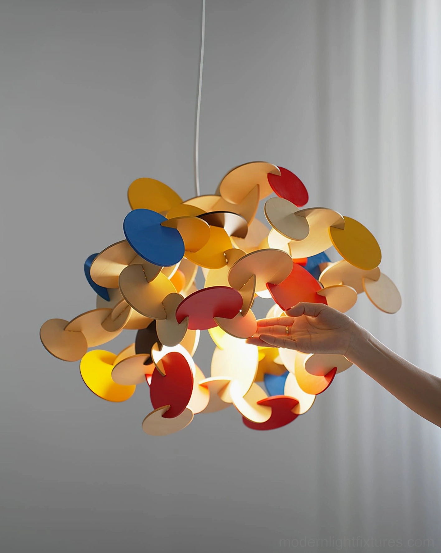 Bau colorful pendant lamp interior illumination showing light diffusion through wooden disc layers