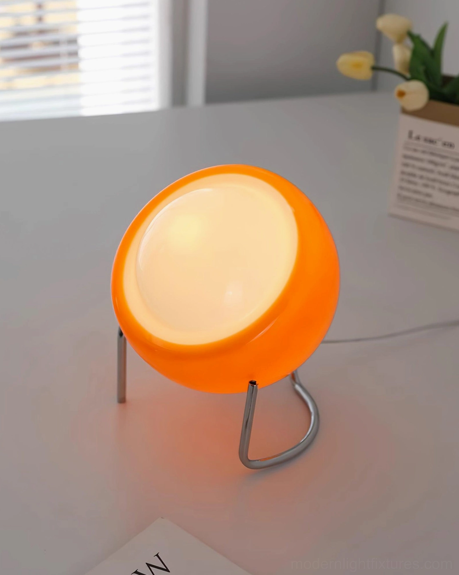 Bauhaus table lamp close-up showing smooth glass dome finish and chrome metal construction details