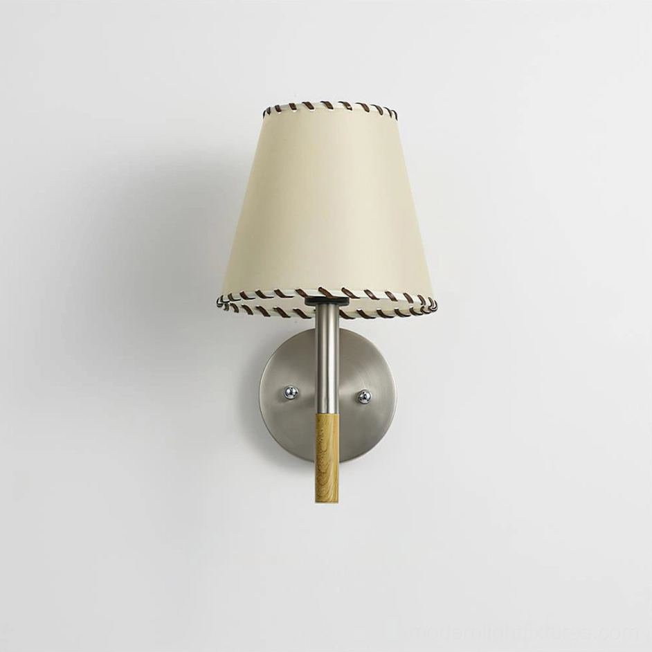 BC2 wall sconce showing brushed metal base with natural wood central rod and cream fabric lampshade