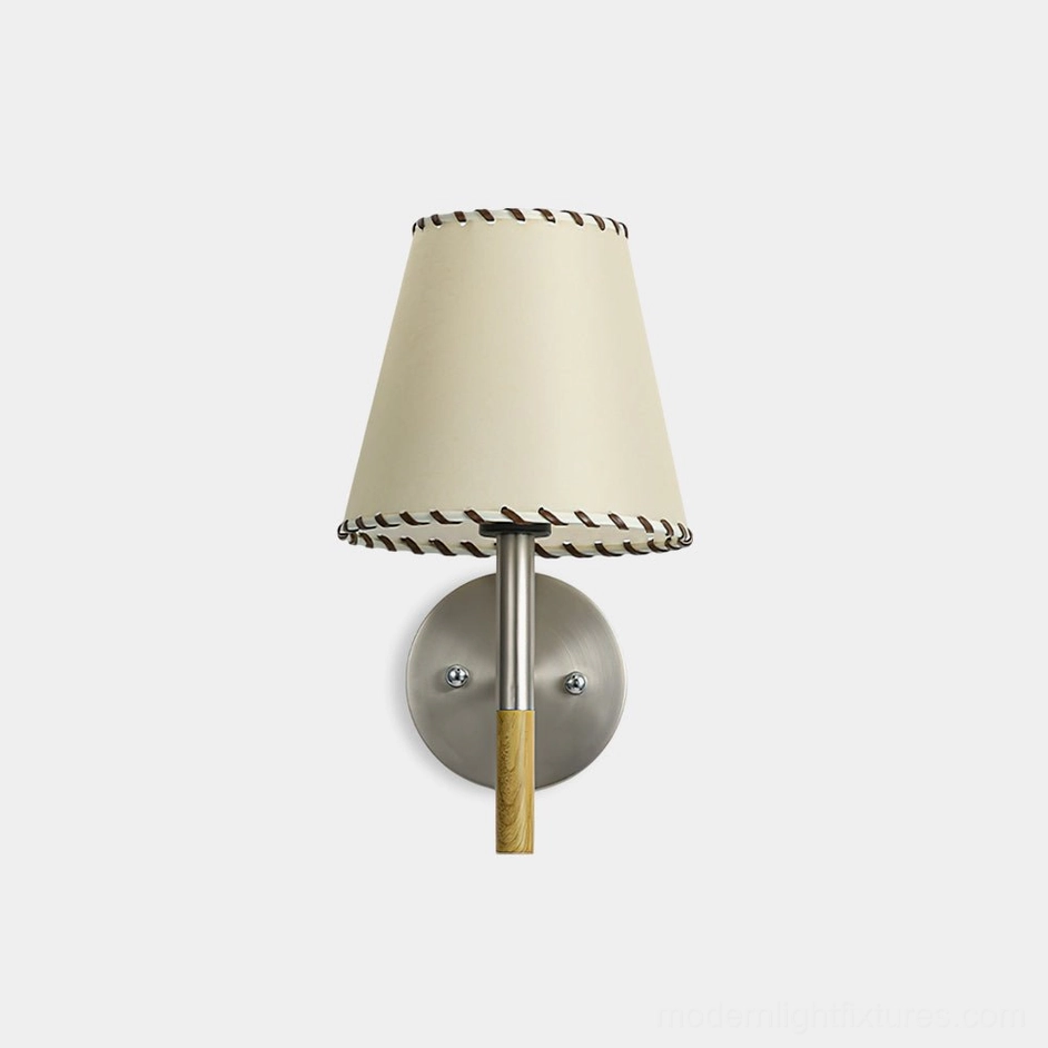 BC2 industrial wall sconce front view with cream hand-stitched fabric shade and dark contrast edging on white studio background