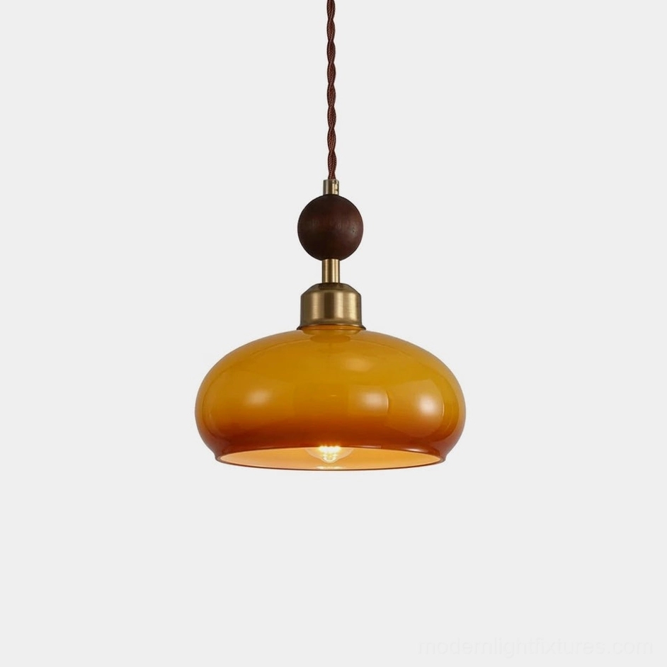 Bead pendant light with amber glass dome and brass detailing - mid-century modern design studio view