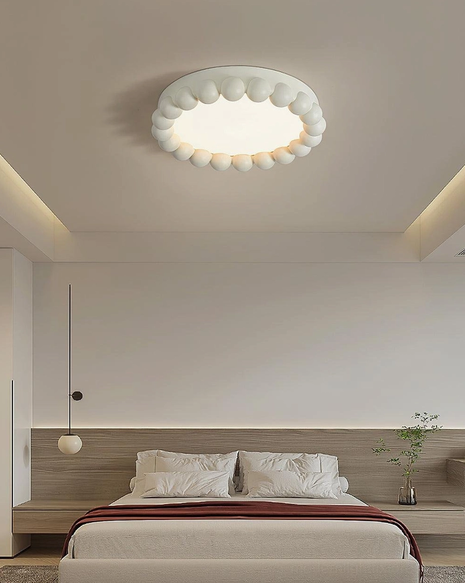 Beaded ceiling light fixture mounted in contemporary living room with minimalist décor