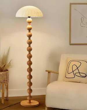 Modern beaded floor lamp in living room interior - warm wood tones with neutral decor