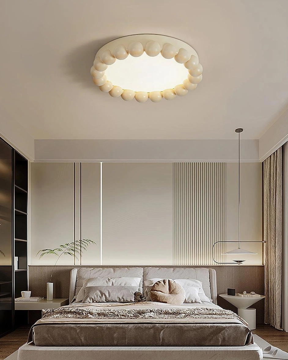 Beaded LED ceiling fixture showing warm ambient lighting in cozy bedroom environment