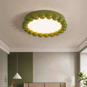 Modern recessed beaded ceiling light in dual-tone green and cream installed in minimalist bedroom with indoor plants