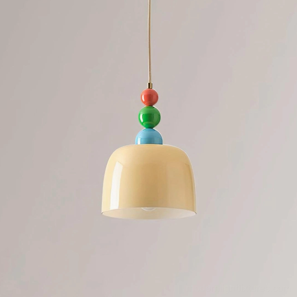 Beaded pendant light with beige frosted glass shade creating warm sophisticated ambiance
