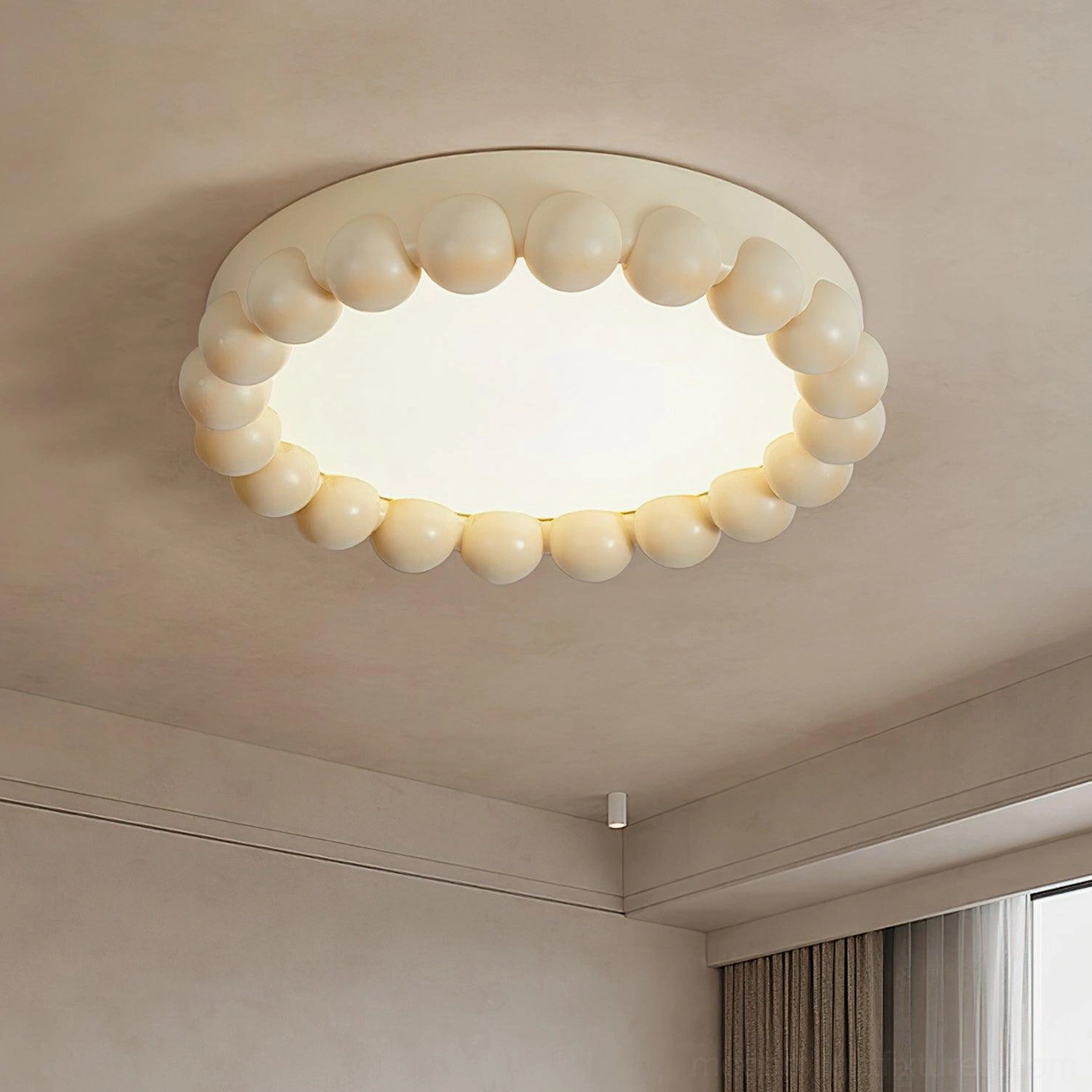 Overhead view of beaded recessed ceiling light creating soft diffused illumination in bedroom