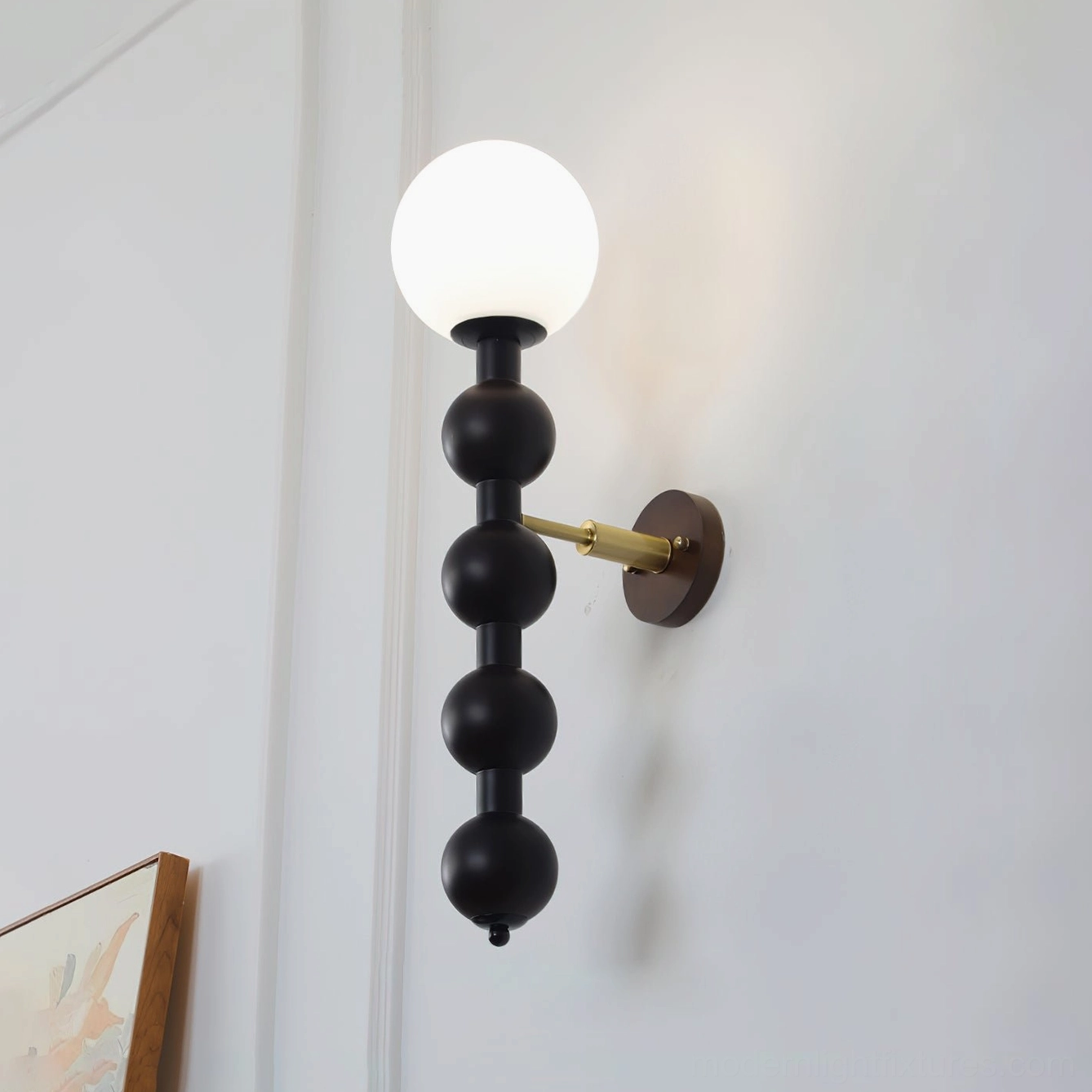 Mid-century modern beaded globe wall sconce in black finish, front facing product view