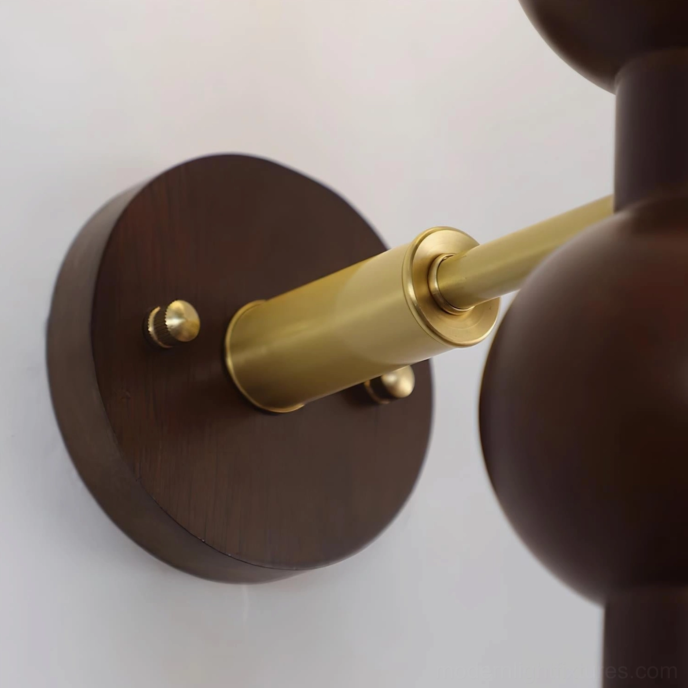 Mid-century modern beaded globe wall sconce as design focal point in decorated room setting