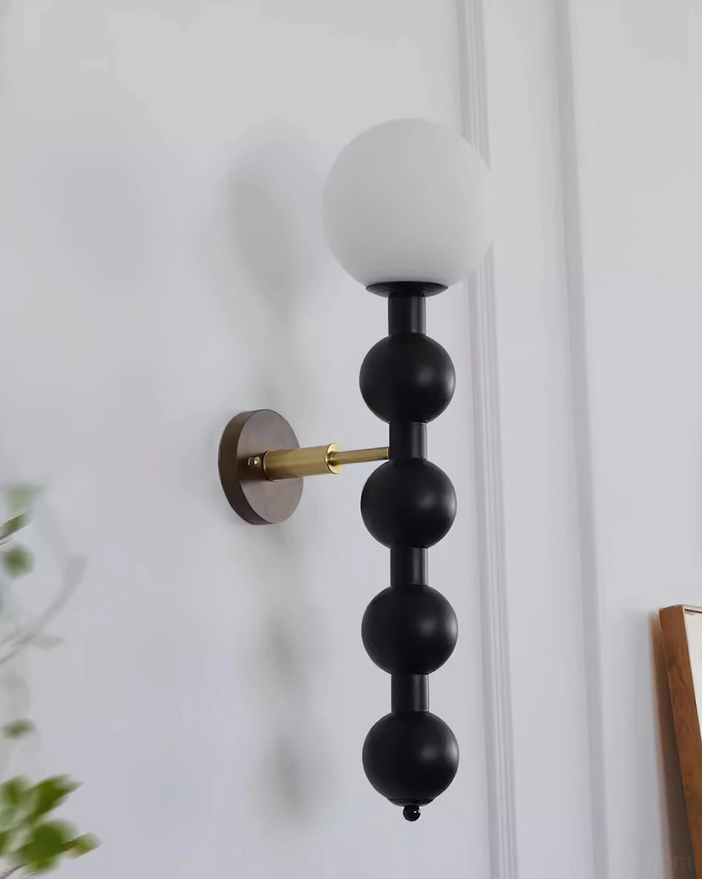 Mid-century modern beaded wall lamp as functional art installation in residential space