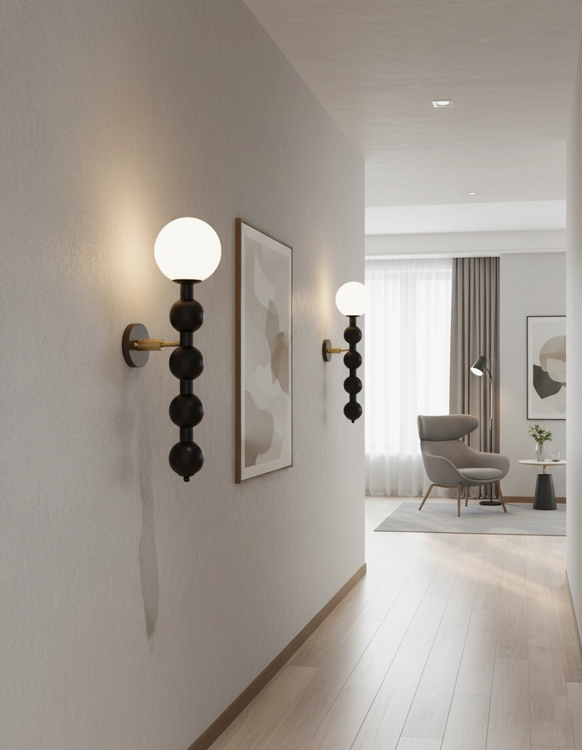 Modern beaded globe wall sconce in walnut finish with contemporary minimalist aesthetic