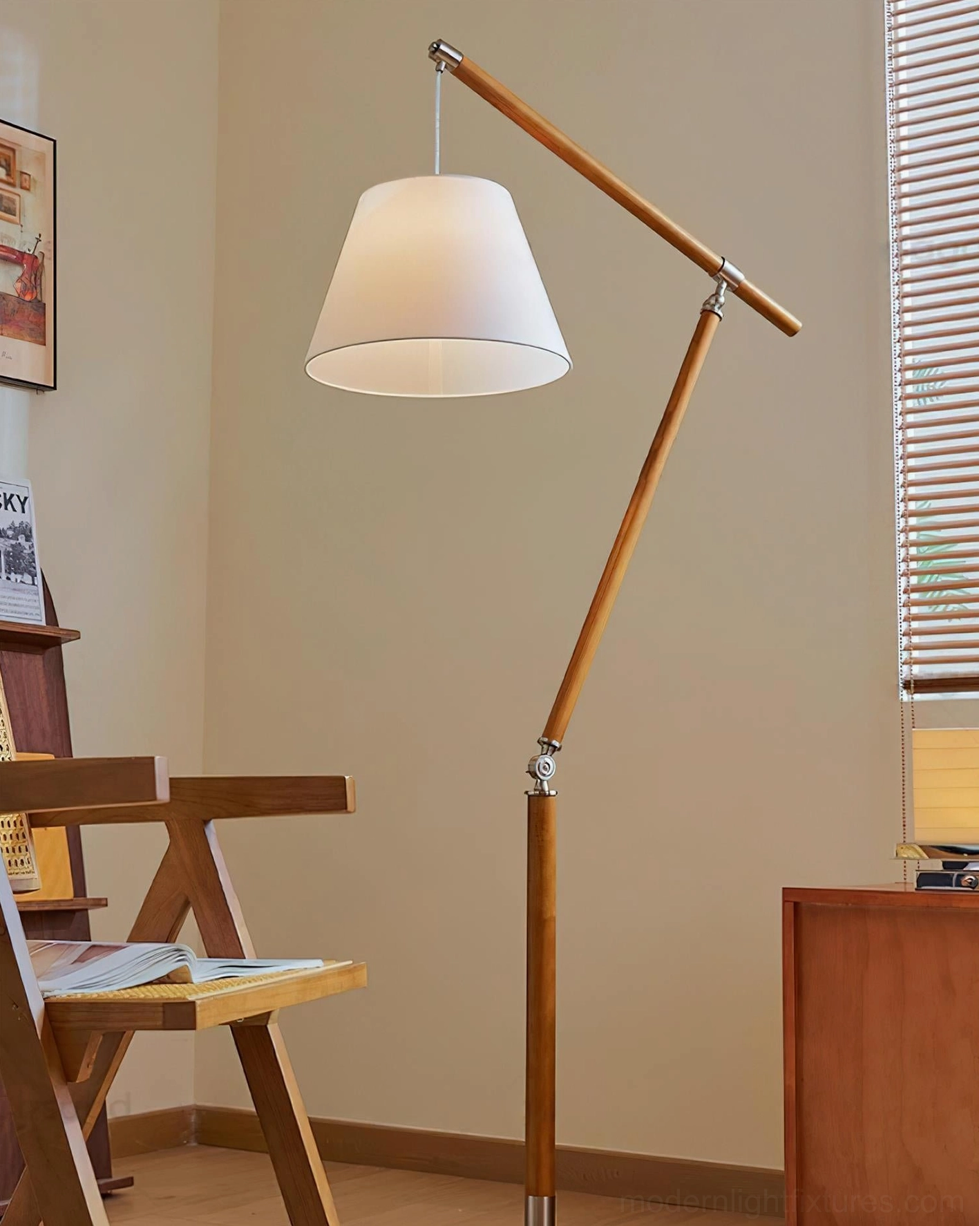 Beamline adjustable cantilever floor lamp with articulated swing joint in retro study setting