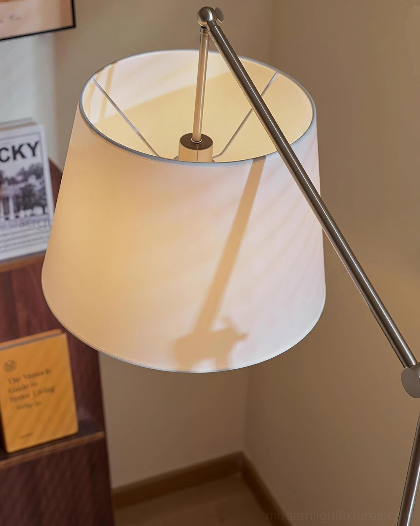 Beamline modern floor lamp demonstrating adjustable light positioning and ambient illumination capability
