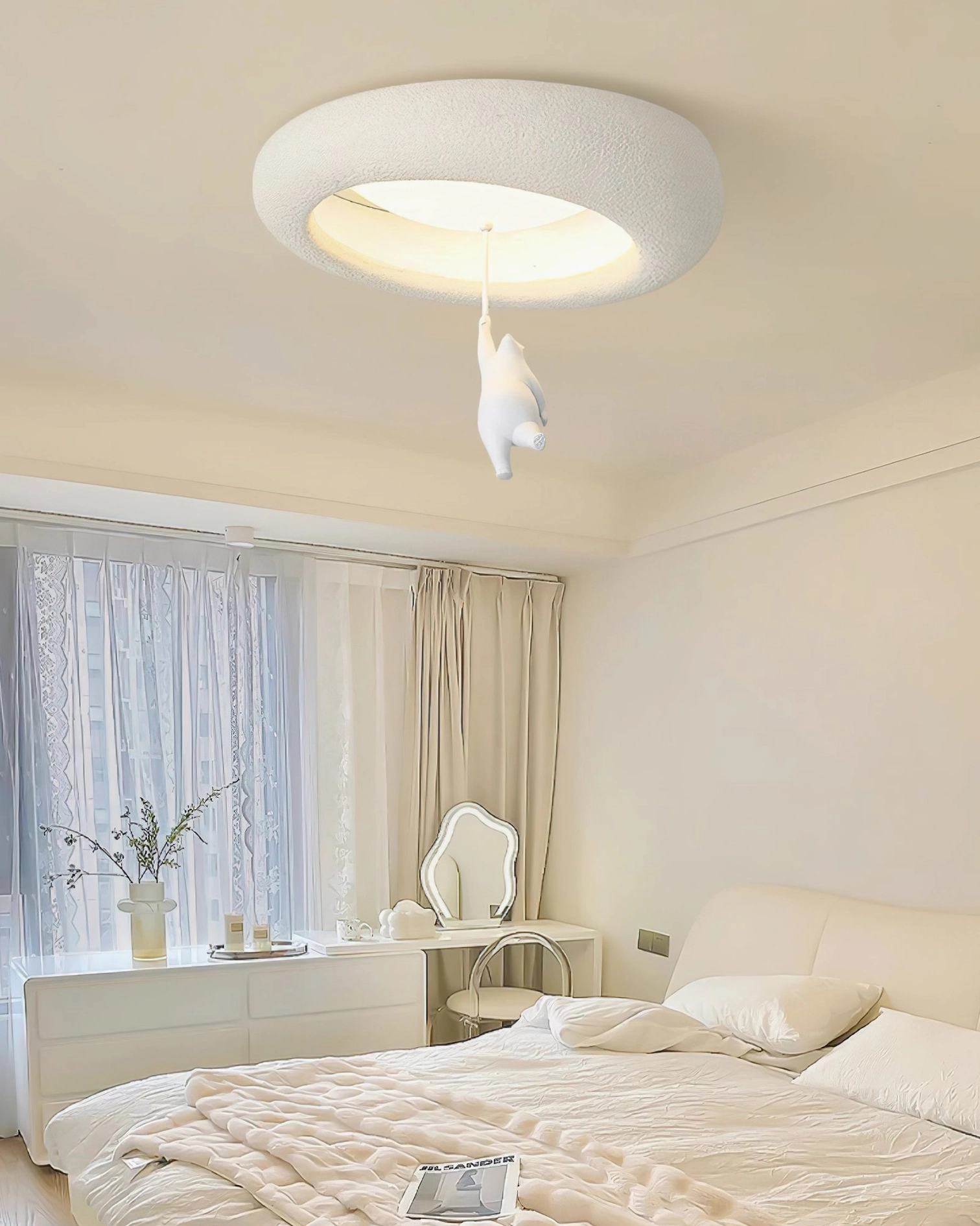 Resin bear ceiling fixture in cozy bedroom with vanity desk, neutral tones, and natural window lighting