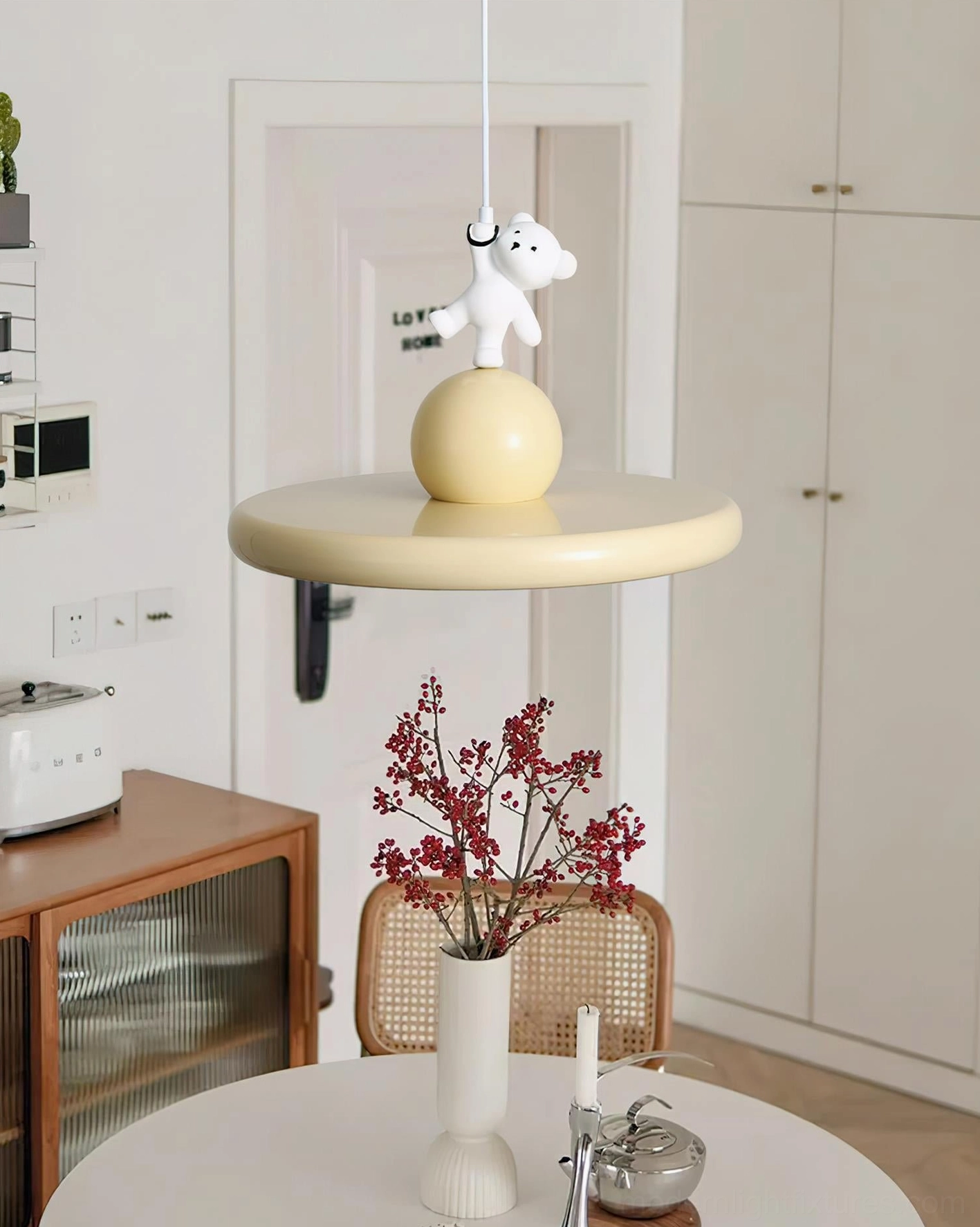 Bear pendant light in dining room, modern hanging lamp illuminating cream style home interior with warm ambient glow