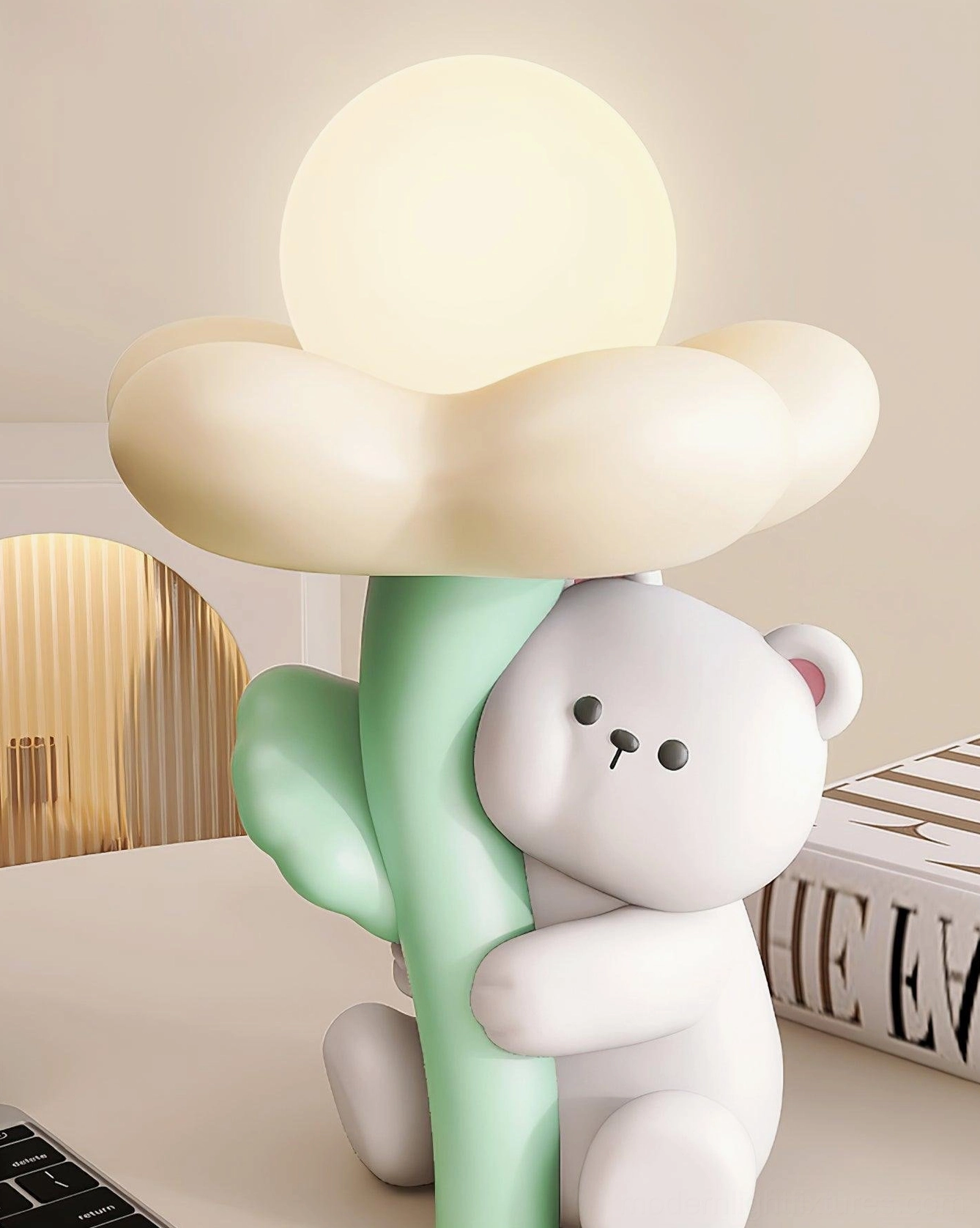 Bear table lamp in contemporary home setting, right three-quarter view with fashion book and arched wall decor