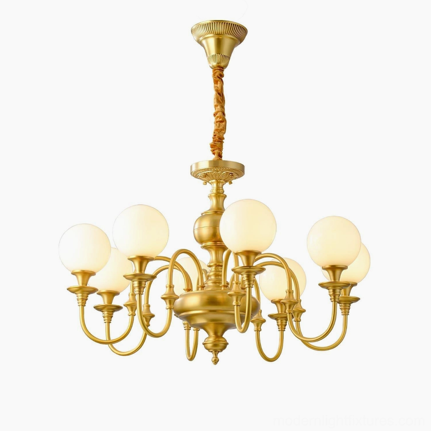 Beatty brass chandelier illuminated in elegant home setting, showcasing warm glow and sophisticated ambiance
