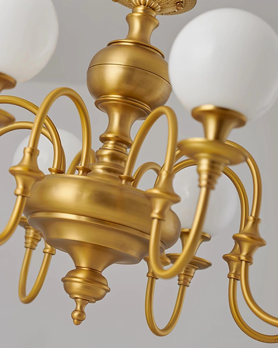 Beatty brass chandelier lifestyle image showing warm ambient lighting effect in modern transitional interior