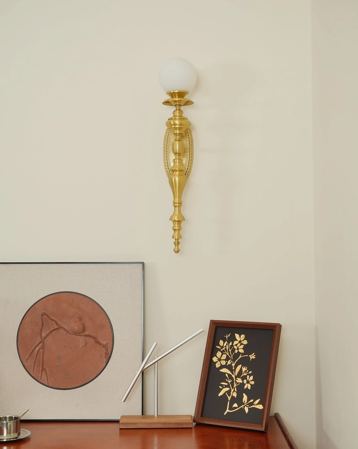 Dimmer compatible brass wall sconce with adjustable warm ambient light in luxury powder room