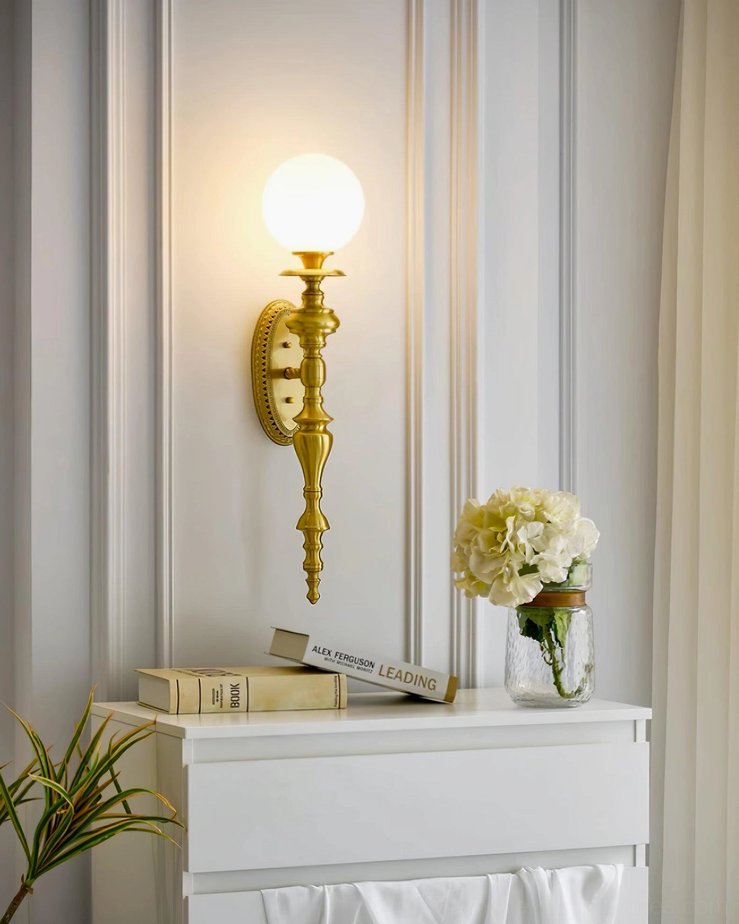 Beatty brass wall sconce paired symmetrical installation flanking hallway mirror or artwork