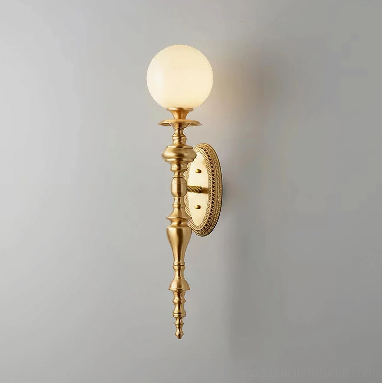 White brass finish Beatty wall sconce in contemporary bedroom bedside mounting position