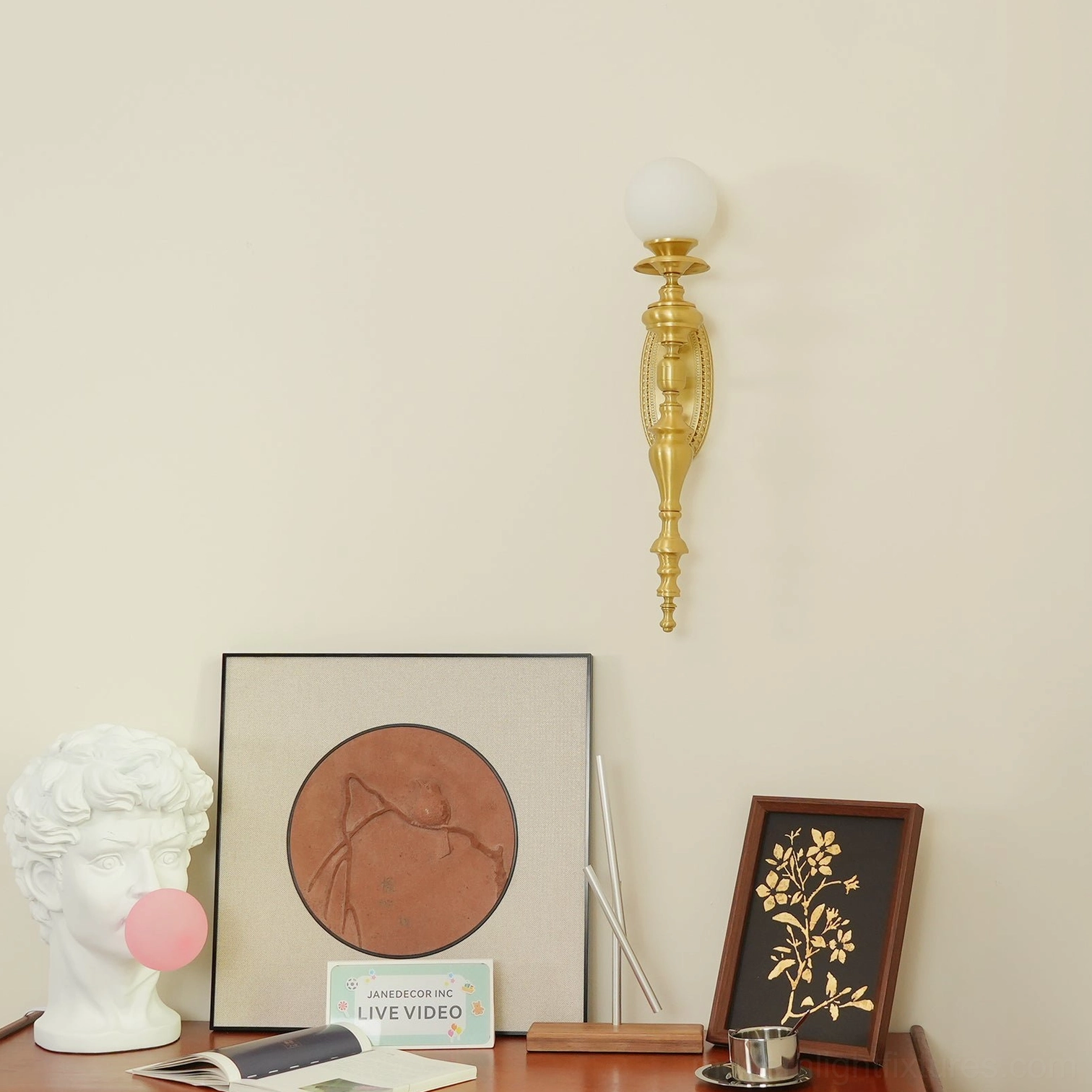 Brass wall sconce showing warm gold patina developing on premium handcrafted brass material