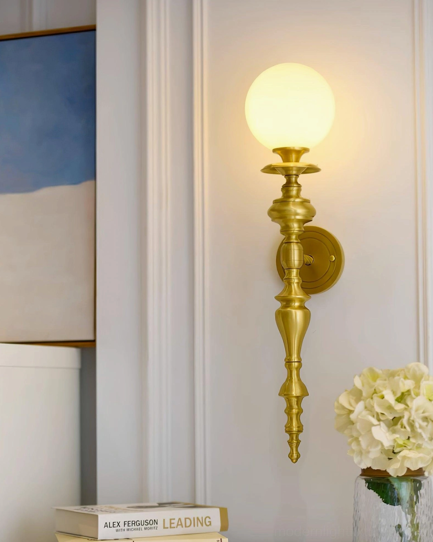 Beatty brass wall sconce in Scandinavian refined interior design with minimalist aesthetic