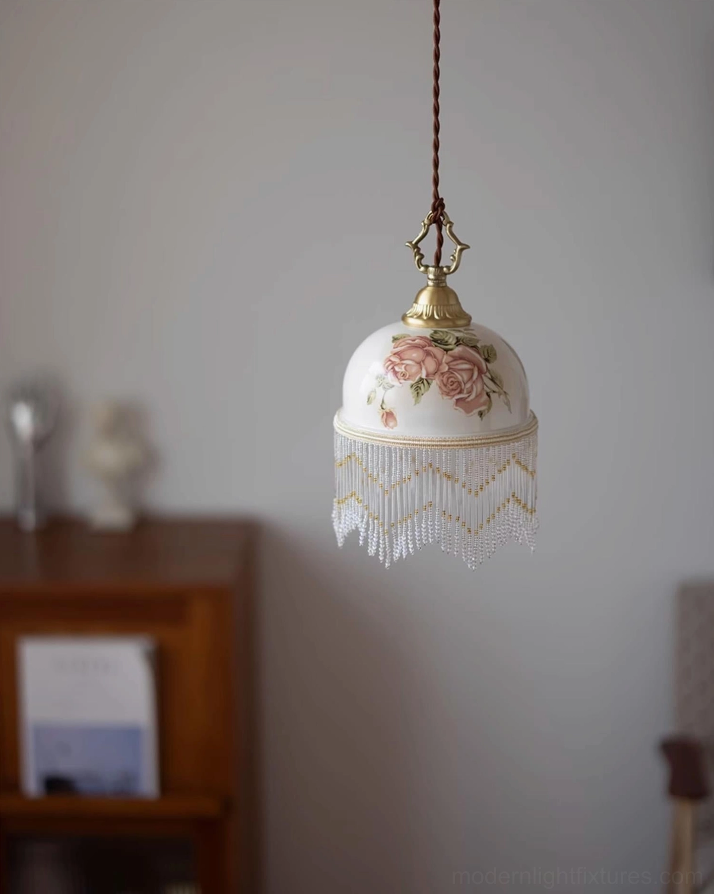Beaudine artisanal ceramic pendant light with hand-painted motifs and decorative beaded cascade fringe
