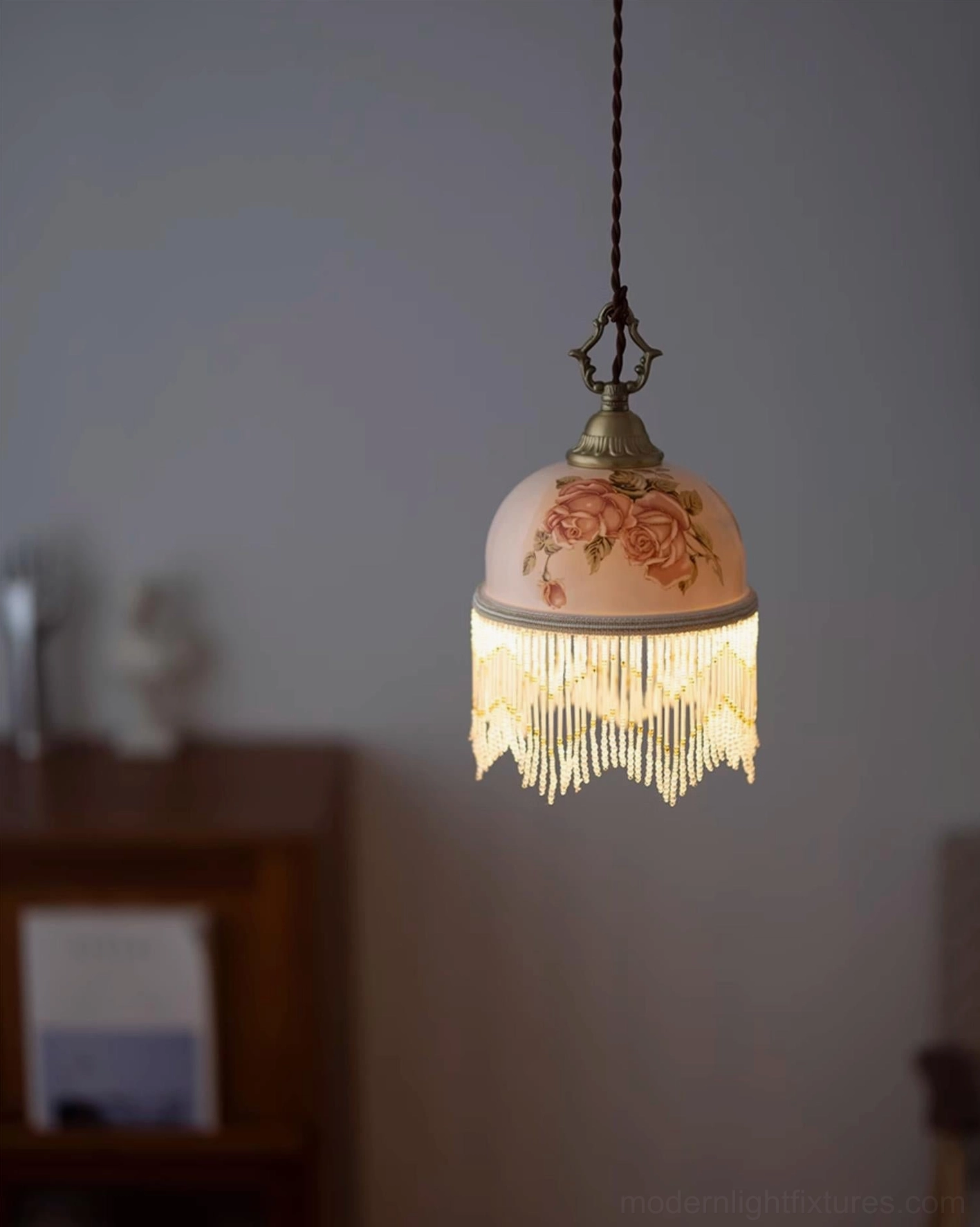 Beaudine ornamental pendant light with brass and ceramic construction, ideal for dining rooms and parlors