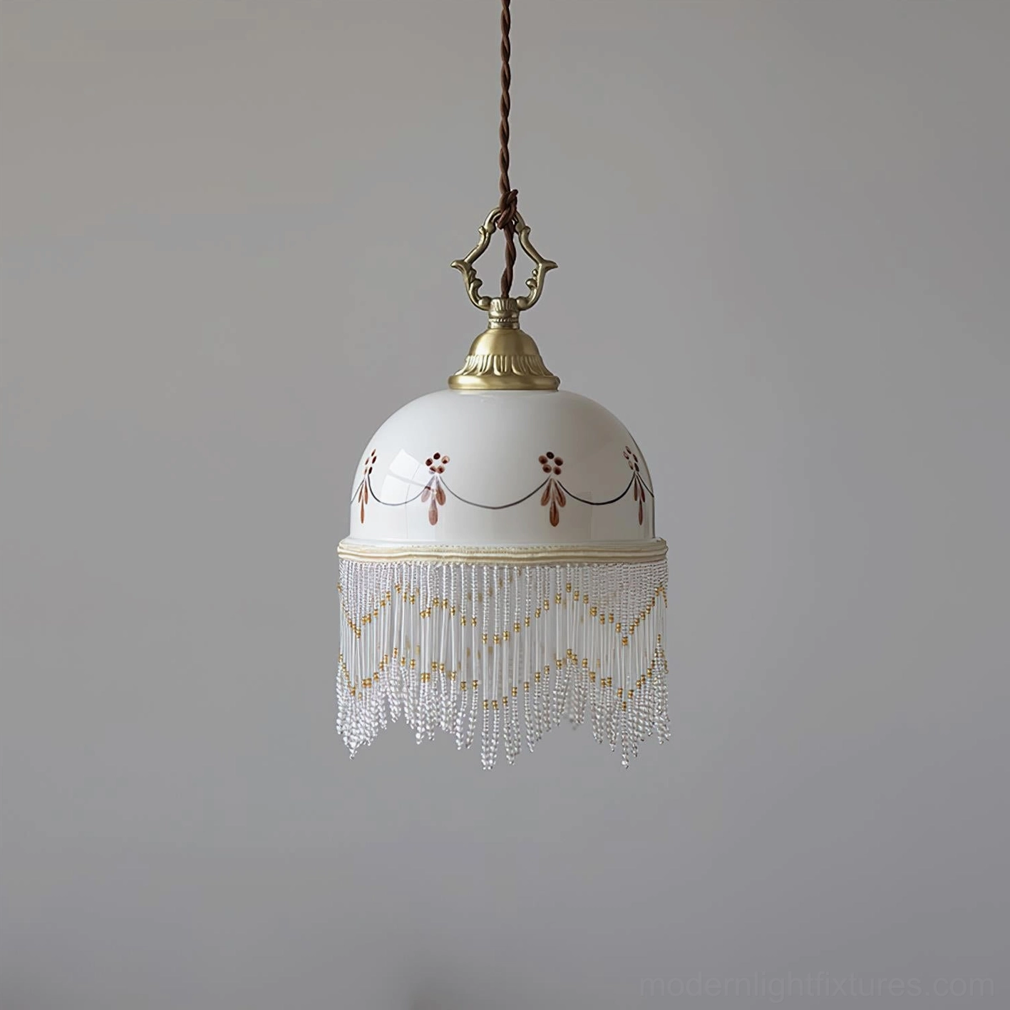 Beaudine ornamental ceramic pendant light with full beaded tassel fringe and refined brass detailing
