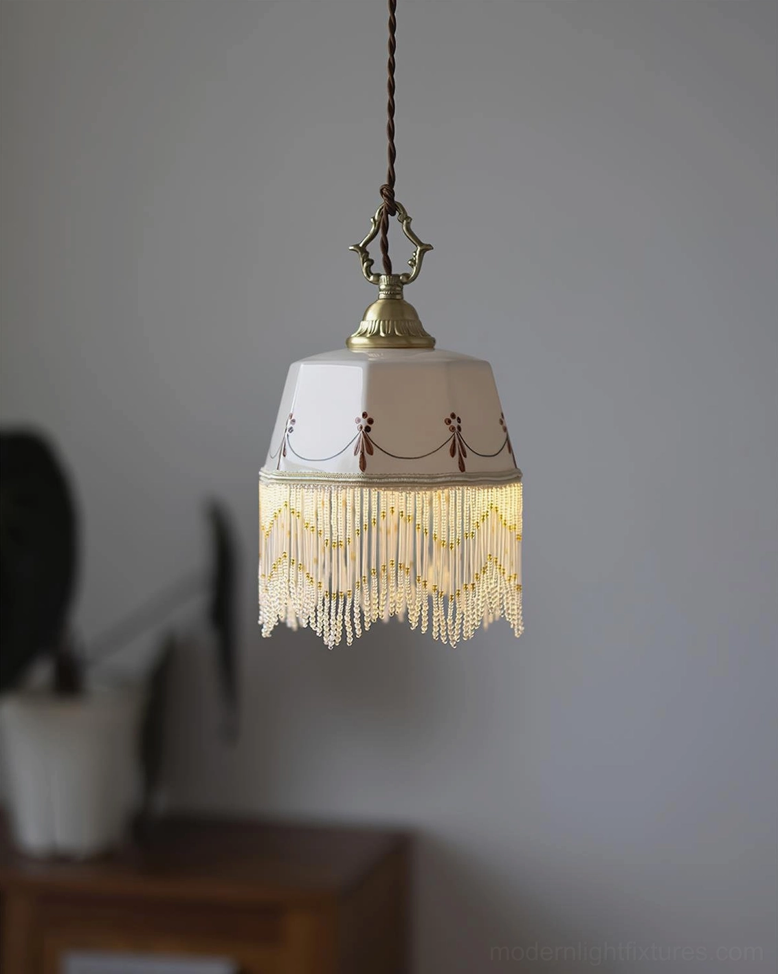 Beaudine vintage ceramic pendant light with cascading beaded fringe, suitable for upscale retail and hospitality