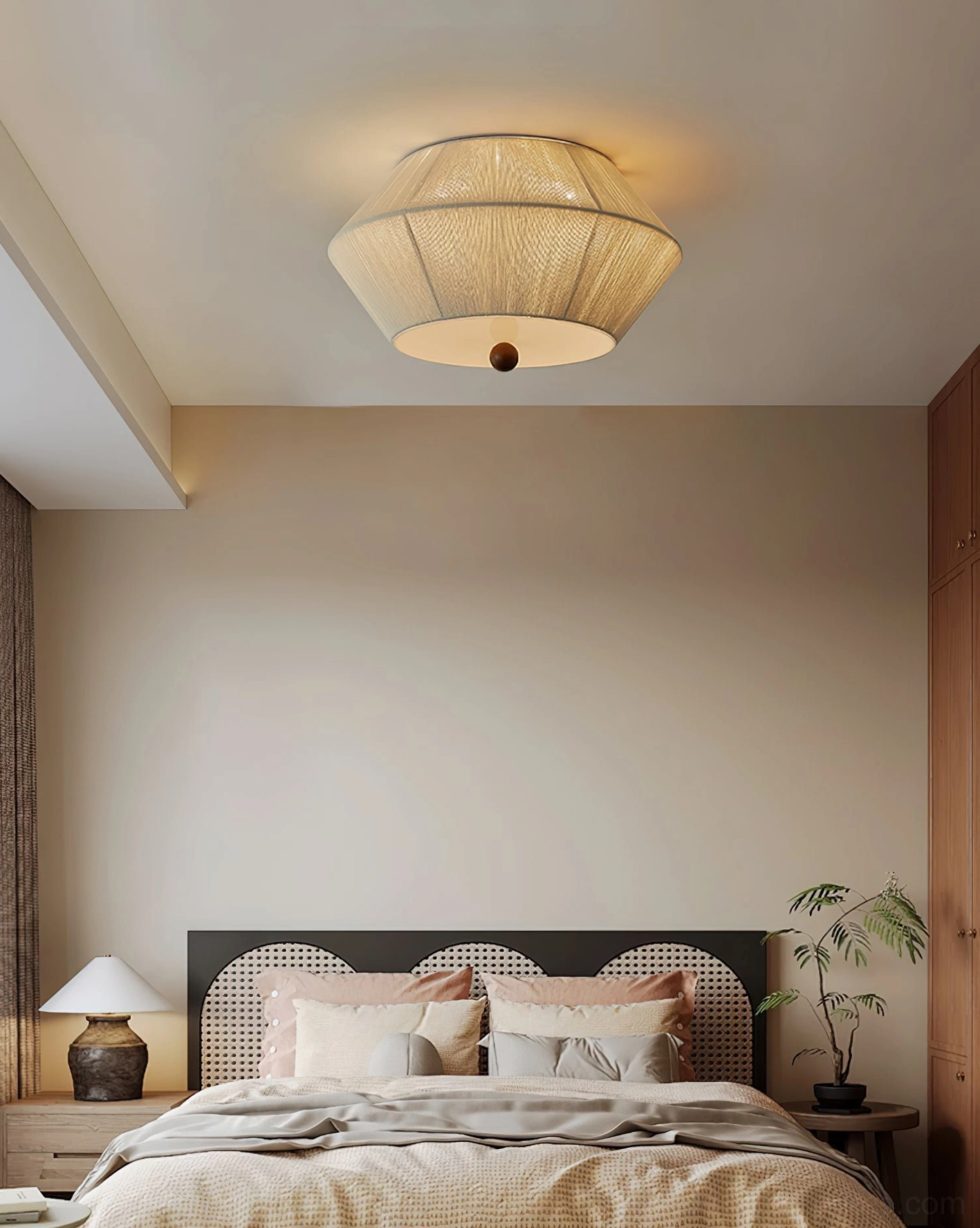 Modern ceiling light in warm wabi-sabi minimalist bedroom with upholstered bed and soft ambient lighting