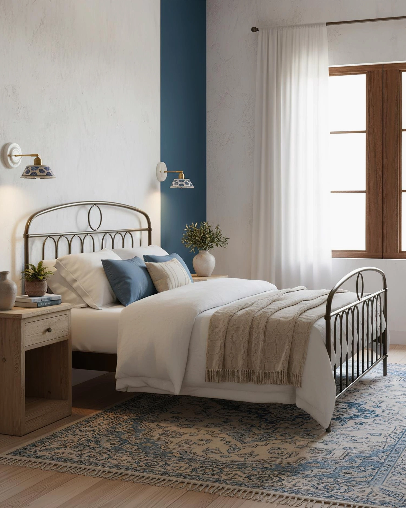 Pair of indigo ceramic wall sconces in vintage bedroom with black metal bed frame
