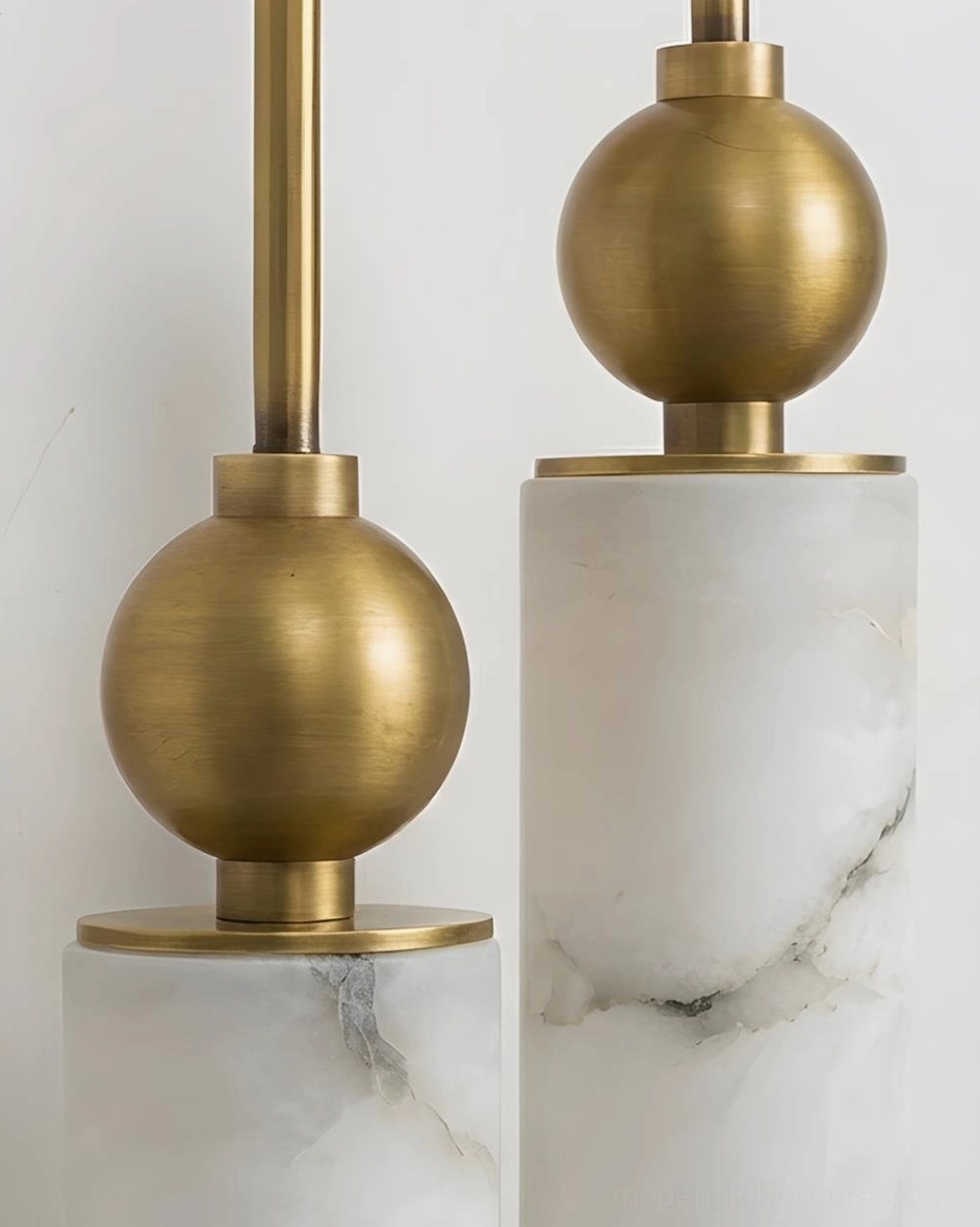Modern alabaster wall sconce installed above bedroom vanity - soft warm lighting with translucent shade and brass frame