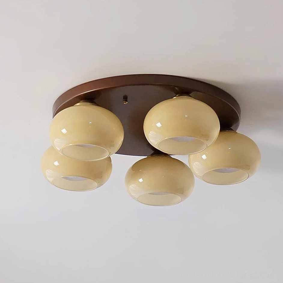 Beige 5-head handblown glass ceiling light fixture with metal base and frosted glass orbs - product display