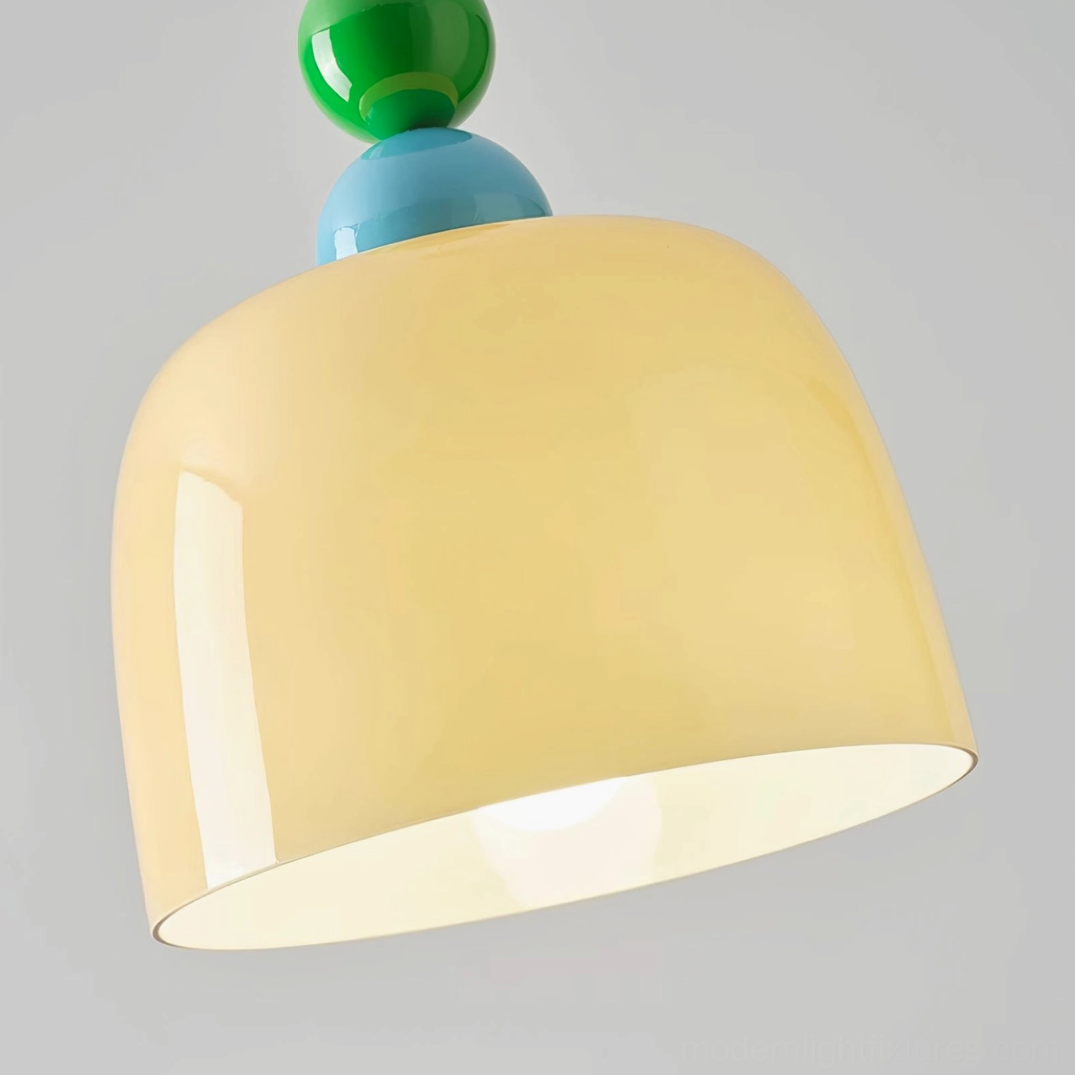 Beige bead finial pendant lamp with warm glass dome creating soft ambient lighting