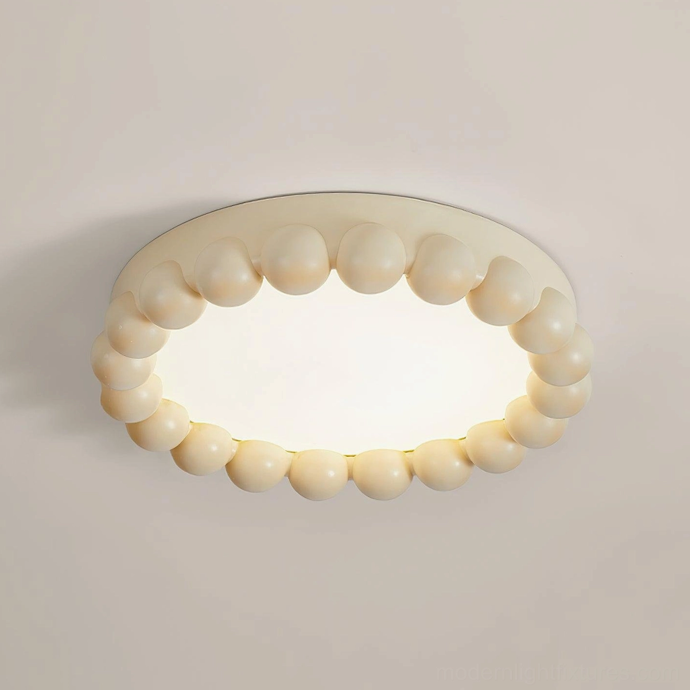 Beige beaded recessed ceiling light fixture providing warm ambient light in bedroom setting