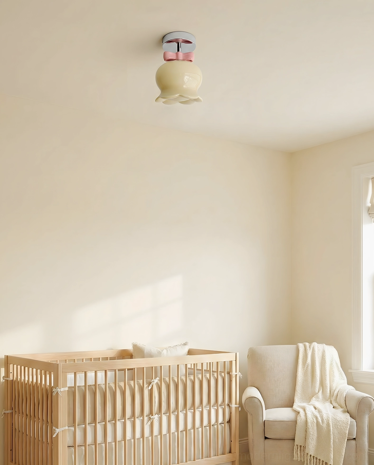 Beige glass bell ceiling light with soft focus in pastel neutral nursery space, gentle warm minimalist home decor environment