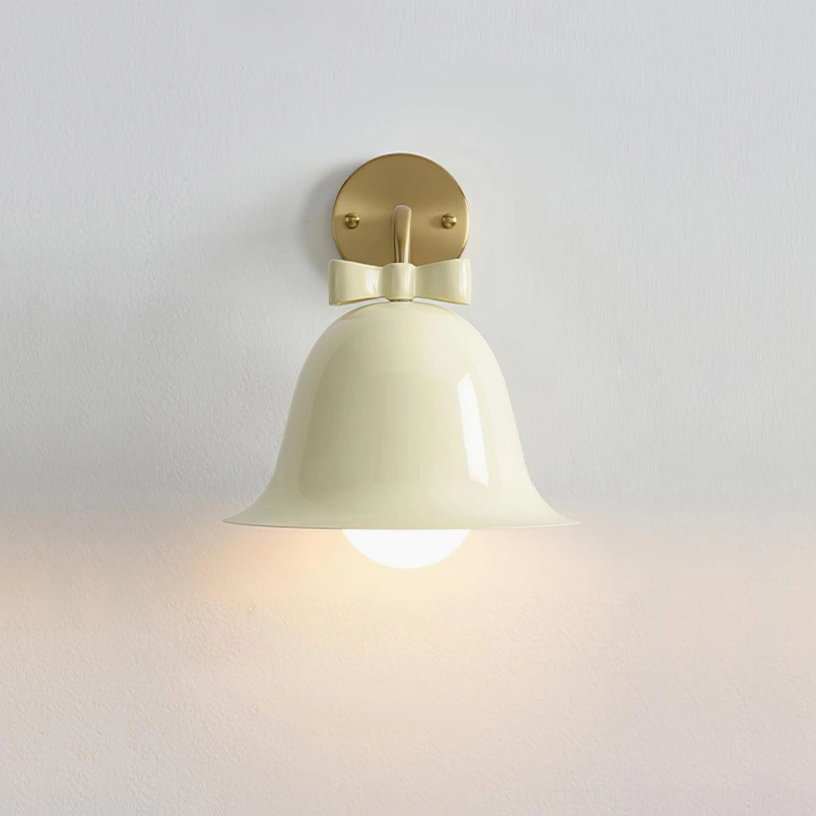 Beige ceramic bell wall lamp with delicate bow knot detail and brass mount in Nordic minimalist style