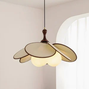 Modern flower-shaped pendant lamp in beige with warm glowing bulbs illuminated in French-style living room with arched window
