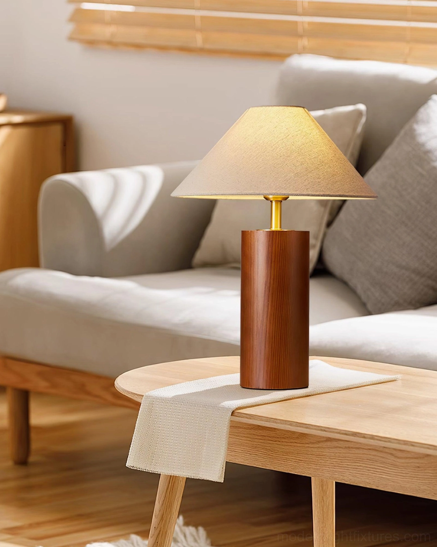 Beige fabric shade table lamp creating inviting ambient glow in home interior space