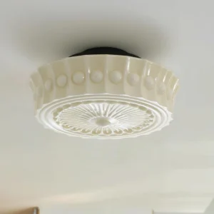 Beige Jeevika flush mount ceiling fixture installed on ceiling, upward-angle view showcasing embossed glass shade detail