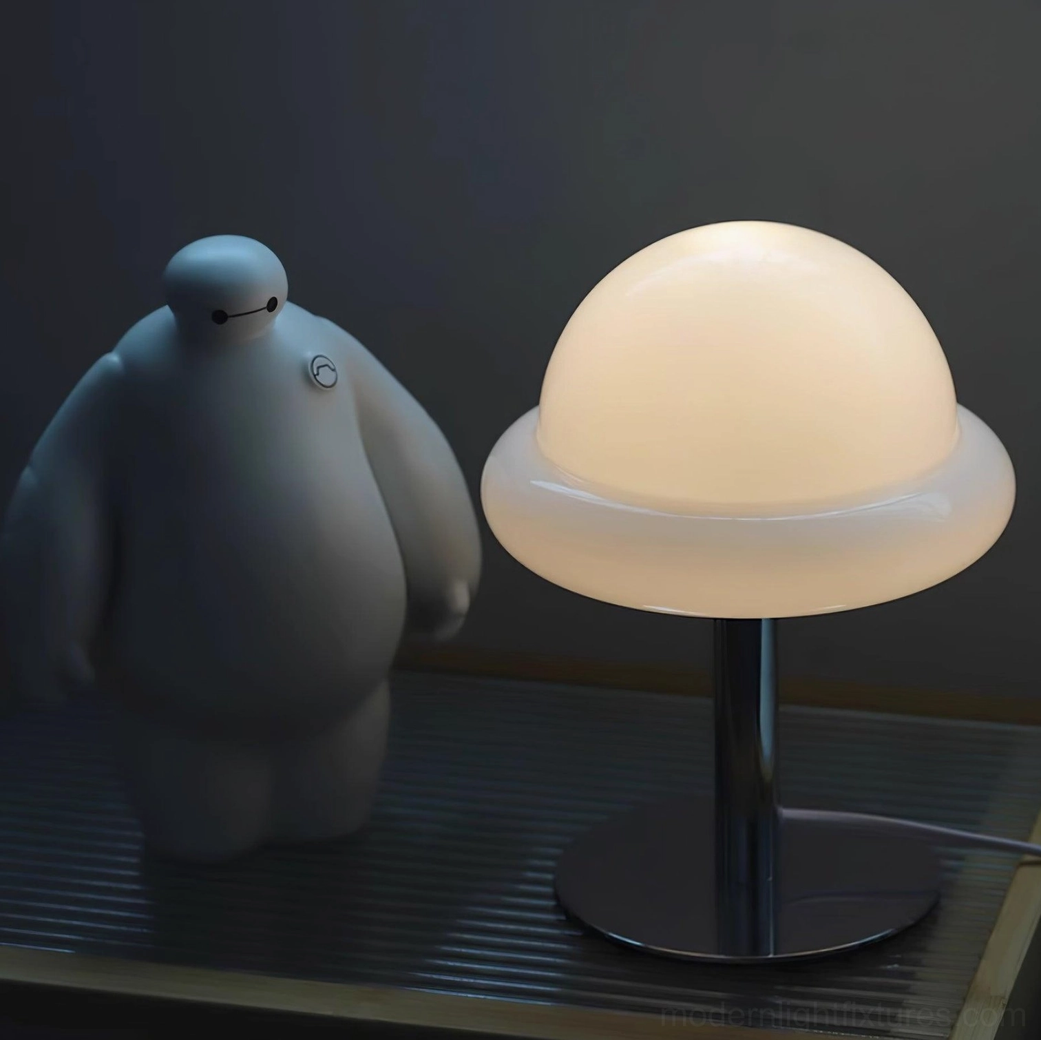 Kleine mushroom table lamp in beige glass with polished chrome hardware, accent lighting display
