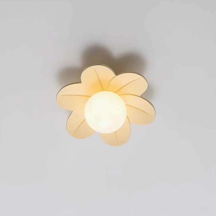 Beige resin petal ceiling fixture flush mounted in contemporary bathroom above vanity mirror